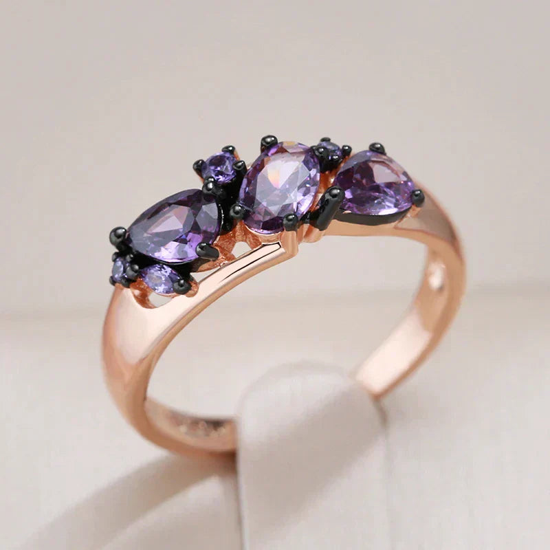 Elegant ring with purple crystals in gold