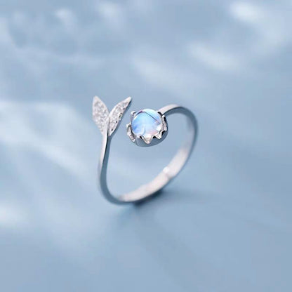 Adjustable ring with dolphin tail made of sterling silver and blue zirconium dioxide